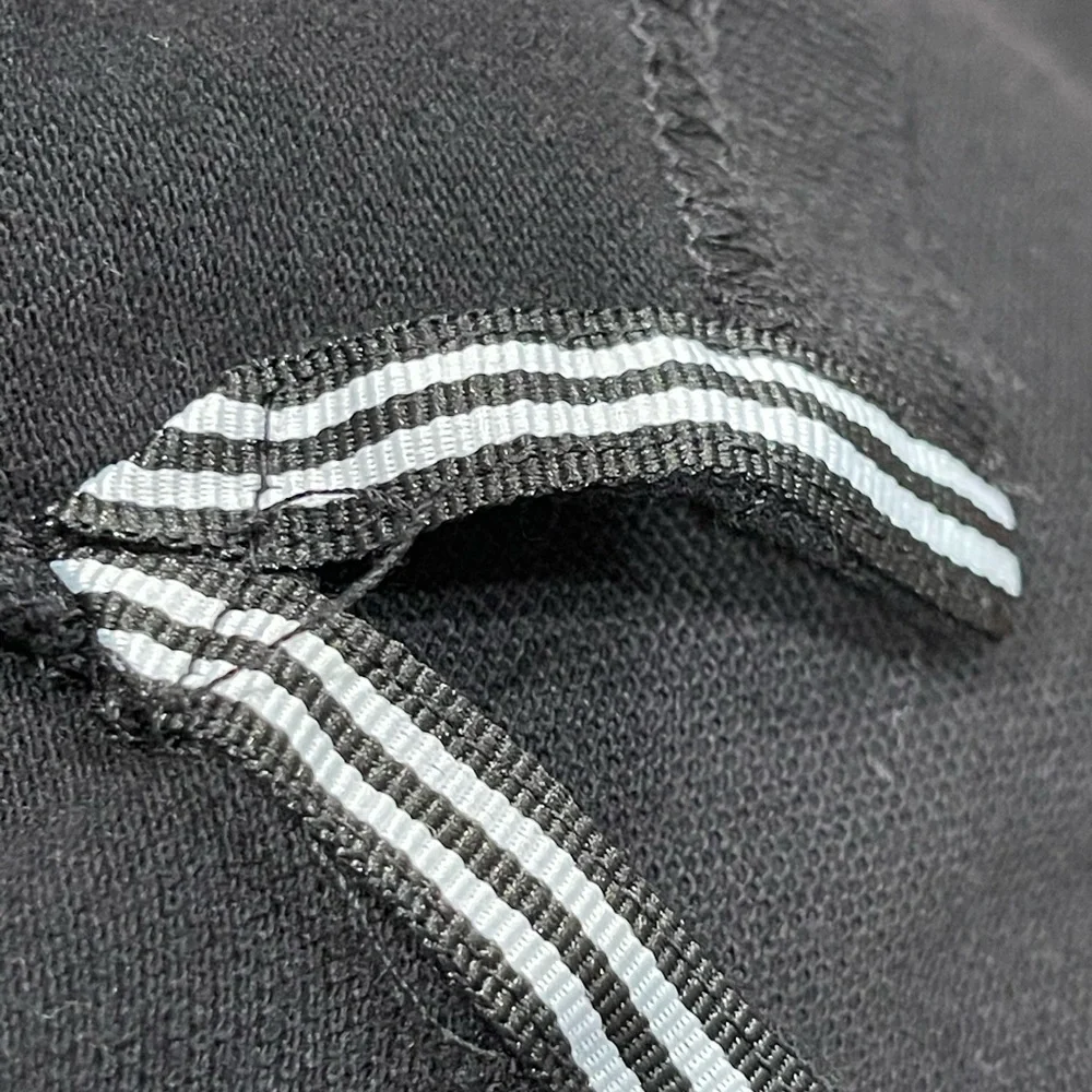 Stylish Black Polo Shirt with White Accents - Picture 9 of 10